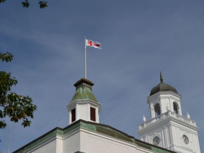 Grand Council Flag of the Mi'kmaw Nation flying above University Hall