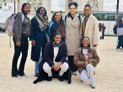 The Acadia delegation smiles for a group photo in a downtown area of Geneva.