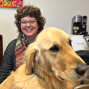 Janet Harnum and her Golden Retriever dog, Buddy