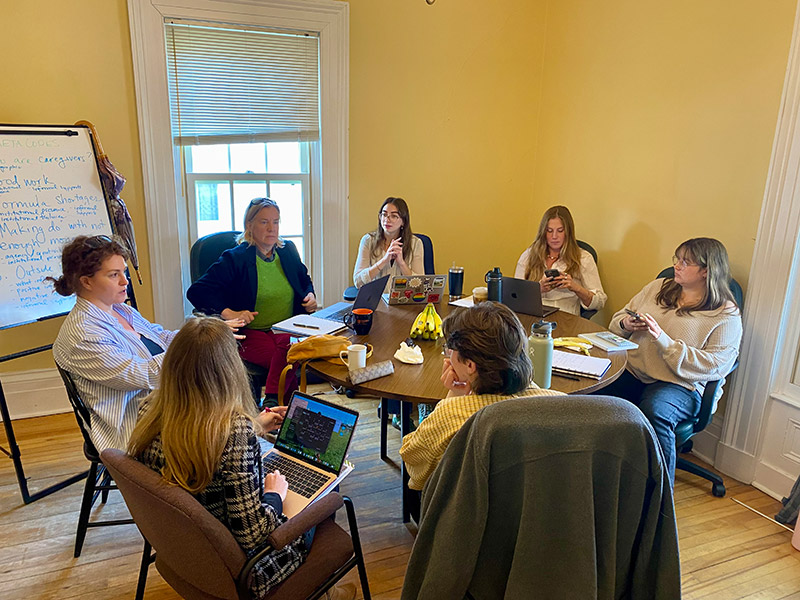 Acadia University research assistants and faculty working side by side to document the everyday labour and uncertainty faced by caregivers. The team reflected a range of academic backgrounds, including sociology, English, nutrition, political science, and