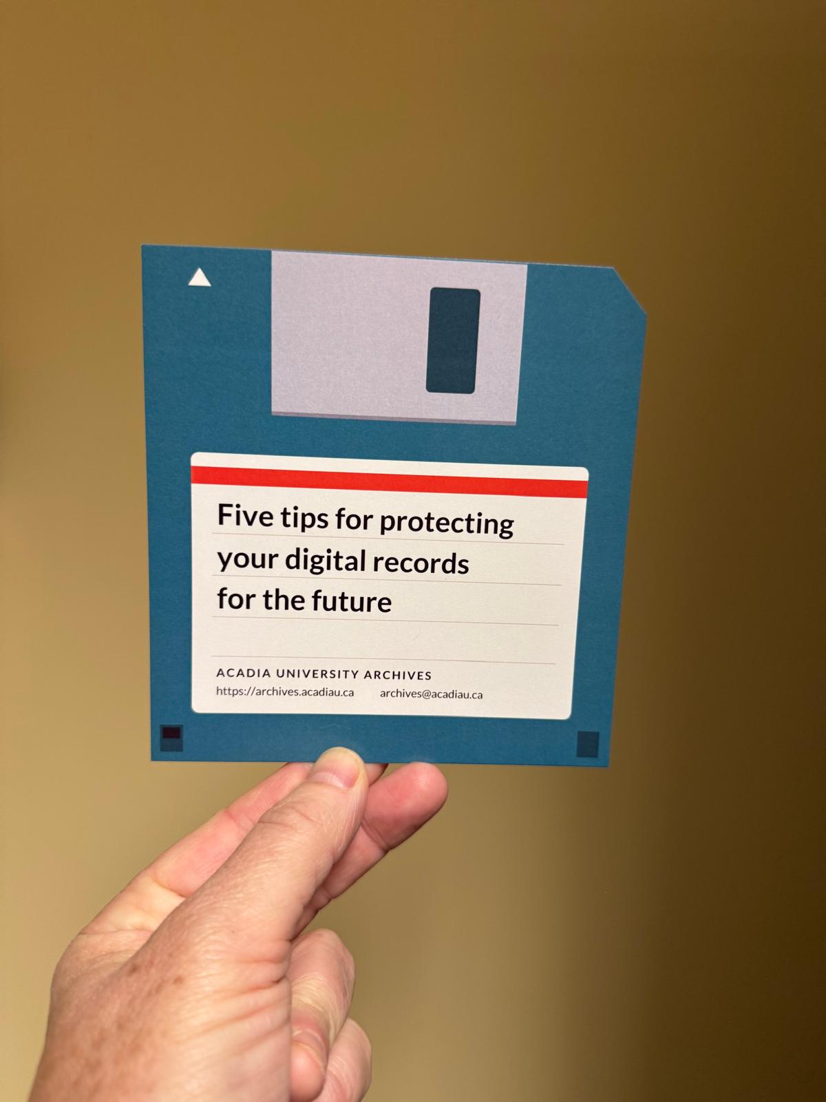 An Acadia Archives pamphlet designed to look like a floppy disk, labelled "Five tips for protecting your digital records for the future"