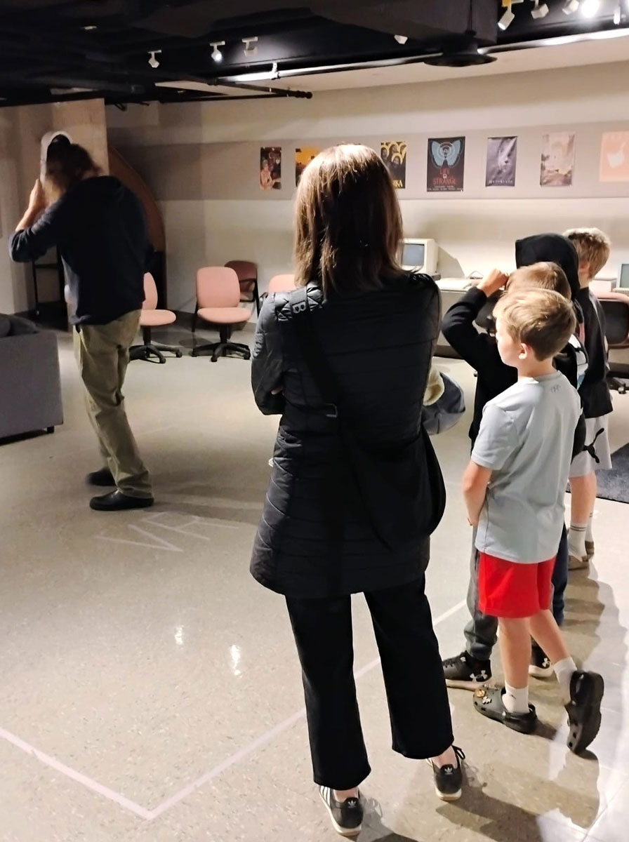 Children watch as Professor Jon Saklofske introduces the Acadia Centre for Critical Play