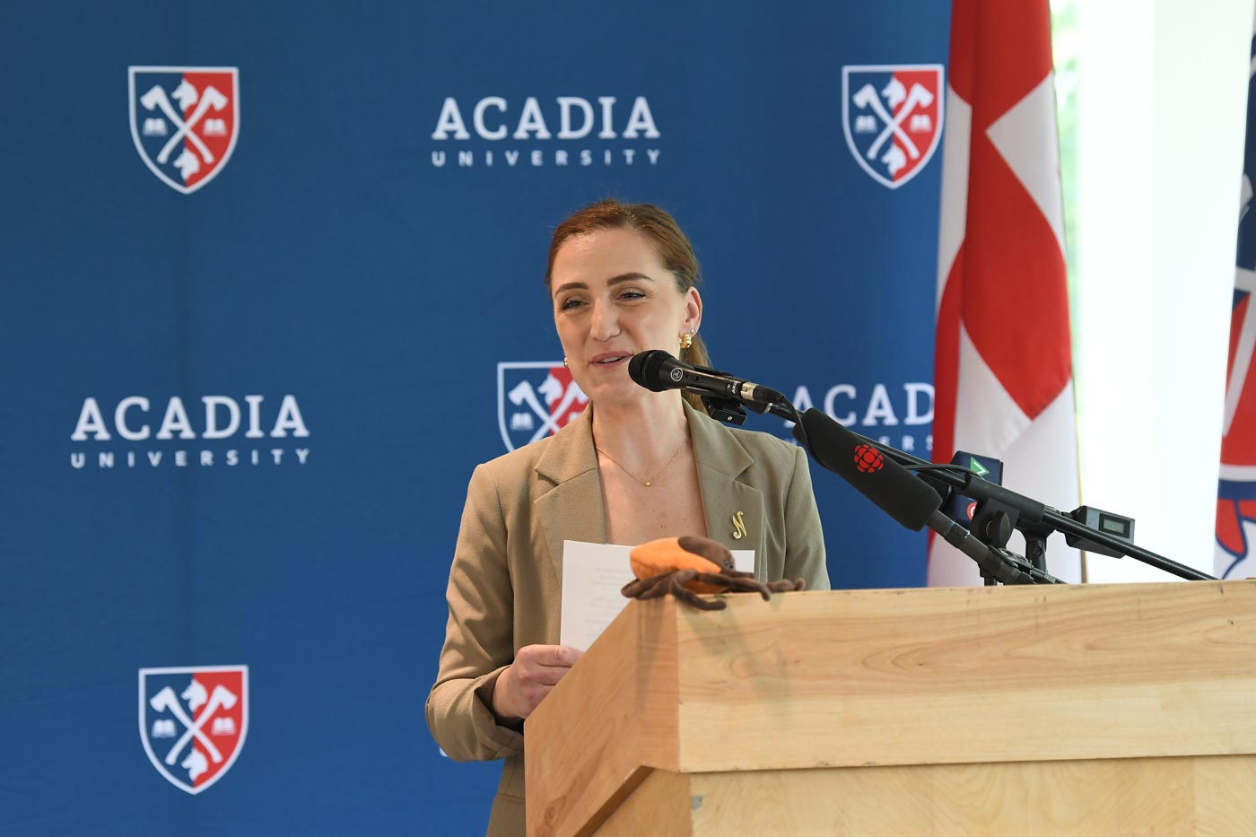 Dr. Nicoletta Faraone speaks at a podium for the CTRIC funding announcement
