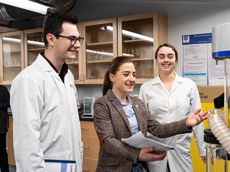 Dr. Nicoletta Faraone works with students in the Huestis Innovation Pavilion