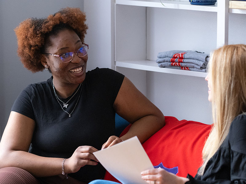 Student speaking with staff
