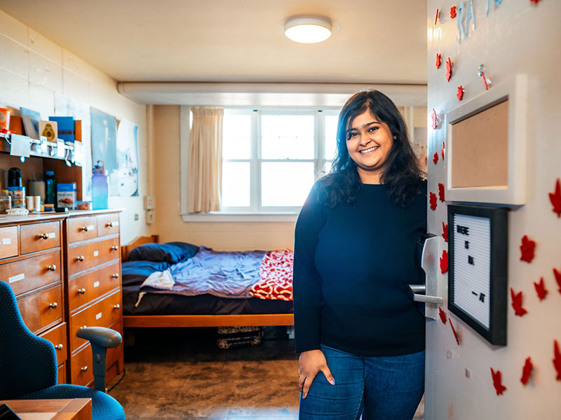 Female student welcoming into dorm room